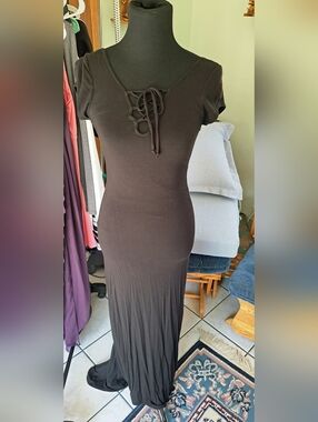Velvet Torch Black Lace-Up Maxi Dress with a train.